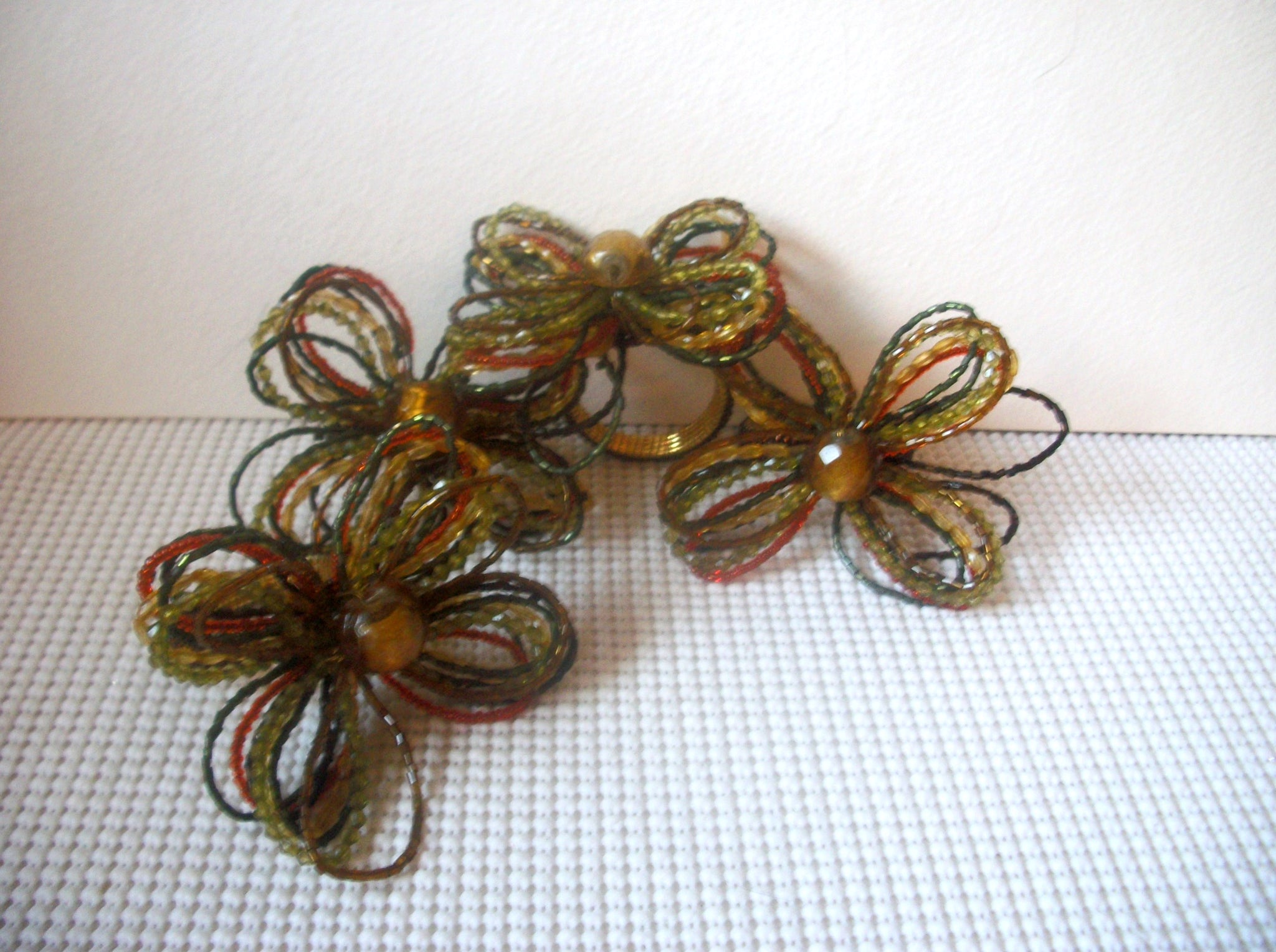 Set of 4 Vintage Napkin Holders Ring, Olive Burnt Orange brown  Fall Tones Hand Wired Flowers Bejeweled Center Foil Glass Bead Vintage